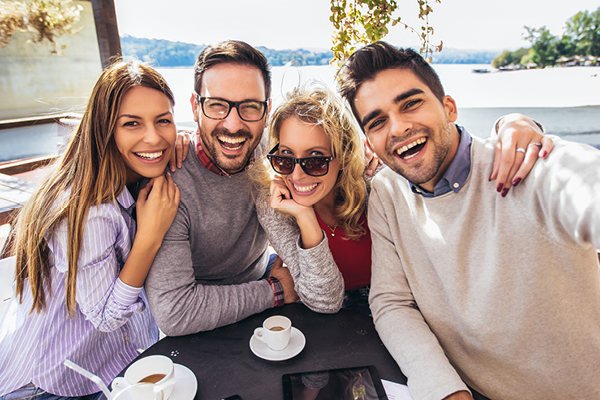 Group of friends taking a selfie at a restaurant