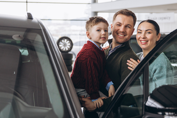 family at the dealership