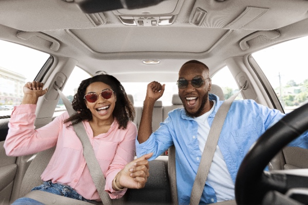 Couple in car cheering