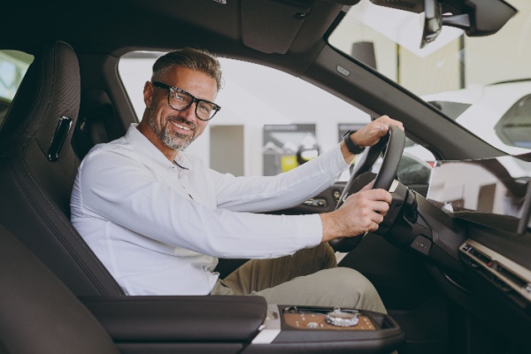 Man in car looking at camera 