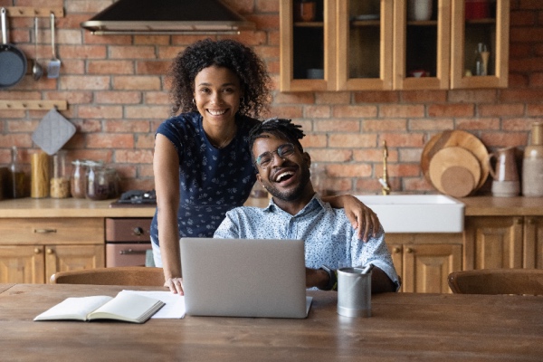 Couple sitting at table at home