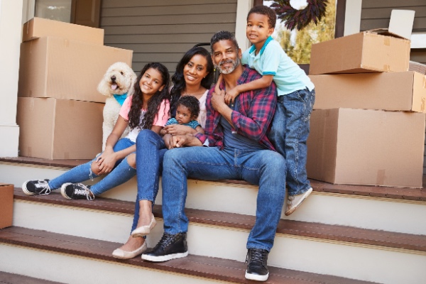 Family sitting on front porch