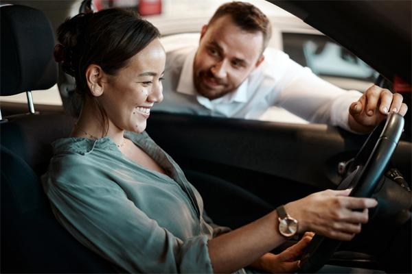 Woman test driving a car 