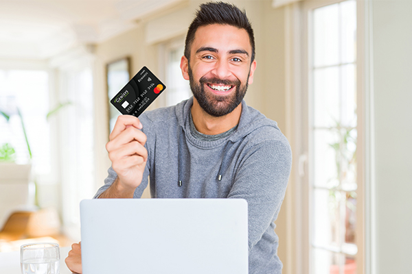 Man with credit card in hand