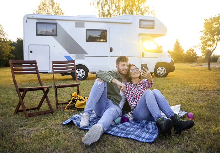 Couple in front of RV