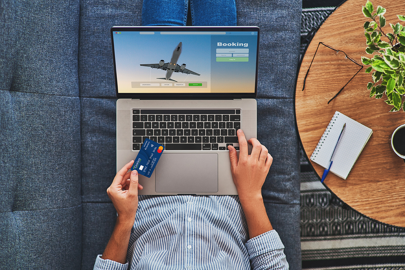 man using laptop to book travel